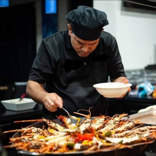 Chef Manuel Berger preparing a gourmet dish