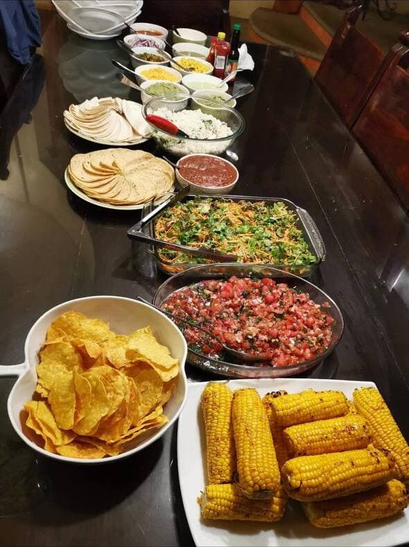 Vibrant taco bar spread for a pool party